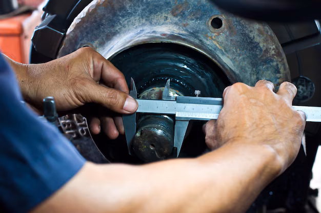 midsection-mechanic-working-repairing-tire